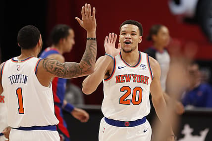 Apr 3, 2021; Detroit, Michigan, USA; New York Knicks forward Kevin Knox II (20) celebrates with forward Obi Toppin (1) after making a basket during the fourth quarter against the Detroit Pistons at Little Caesars Arena. Mandatory Credit: Raj Mehta-USA TODAY Sports