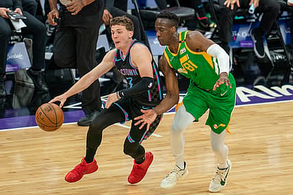 May 16, 2021; Sacramento, California, USA;  Sacramento Kings guard Kyle Guy (7) drives in against Utah Jazz guard Miye Oni (81) during the second quarter at Golden 1 Center. Mandatory Credit: Neville E. Guard-USA TODAY Sports