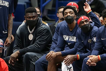 Oct 29, 2021; New Orleans, Louisiana, USA; Injured New Orleans Pelicans forward Zion Williamson, wearing necklace, sits on the bench in the second quarter of their game against the Sacramento Kings at the Smoothie King Center. Mandatory Credit: Chuck Cook-USA TODAY Sports