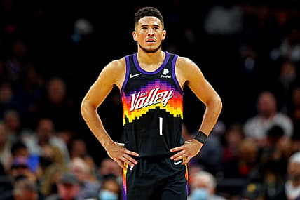 Nov 30, 2021; Phoenix, Arizona, USA; Phoenix Suns guard Devin Booker (1) reacts during the second quarter against the Golden State Warriors at Footprint Center. Mandatory Credit: Mark J. Rebilas-USA TODAY Sports