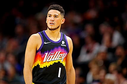 Nov 30, 2021; Phoenix, Arizona, USA; Phoenix Suns guard Devin Booker (1) reacts during the second quarter against the Golden State Warriors at Footprint Center. Mandatory Credit: Mark J. Rebilas-USA TODAY Sports