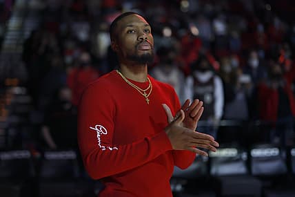 Dec 2, 2021; Portland, Oregon, USA; Portland Trail Blazers point guard Damian Lillard (0) watches introductions prior to the gams against the San Antonio Spurs at Moda Center. Mandatory Credit: Soobum Im-USA TODAY Sports