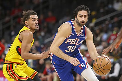 Dec 3, 2021; Atlanta, Georgia, USA; Philadelphia 76ers guard Furkan Korkmaz (30) drives past Atlanta Hawks guard Trae Young (11) in the first quarter at State Farm Arena. Mandatory Credit: Brett Davis-USA TODAY Sports