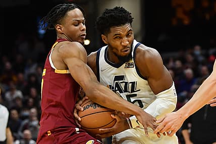 Dec 5, 2021; Cleveland, Ohio, USA; Utah Jazz guard Donovan Mitchell (45) drives to the basket against Cleveland Cavaliers forward Isaac Okoro (35) during the second half at Rocket Mortgage FieldHouse. Mandatory Credit: Ken Blaze-USA TODAY Sports