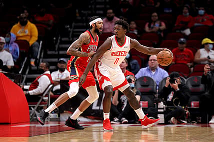 Dec 5, 2021; Houston, Texas, USA; Houston Rockets forward Jae'Sean Tate (8) handles the ball while New Orleans Pelicans forward Brandon Ingram (14) defends during the first quarter at Toyota Center. Mandatory Credit: Erik Williams-USA TODAY Sports