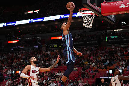 Dec 6, 2021; Miami, Florida, USA; Memphis Grizzlies guard Desmond Bane (22) puts up a shot on Miami Heat forward Caleb Martin (16) during the first half at FTX Arena. Mandatory Credit: Jasen Vinlove-USA TODAY Sports