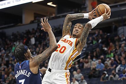 Dec 6, 2021; Minneapolis, Minnesota, USA; Atlanta Hawks forward John Collins (20) grabs the ball away from Minnesota Timberwolves forward Jaden McDaniels (3) in the first quarter at Target Center. Mandatory Credit: Bruce Kluckhohn-USA TODAY Sports
