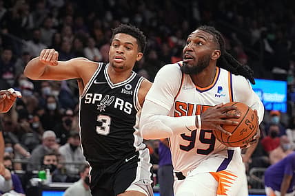 Dec 6, 2021; Phoenix, Arizona, USA; Phoenix Suns forward Jae Crowder (99) drives past San Antonio Spurs forward Keldon Johnson (3) at Footprint Center. Mandatory Credit: Rick Scuteri-USA TODAY Sports