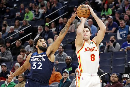 Dec 6, 2021; Minneapolis, Minnesota, USA; Atlanta Hawks forward Danilo Gallinari (8) shoots as Minnesota Timberwolves center Karl-Anthony Towns (32) tries tro defend him in the first quarter at Target Center. Mandatory Credit: Bruce Kluckhohn-USA TODAY Sports