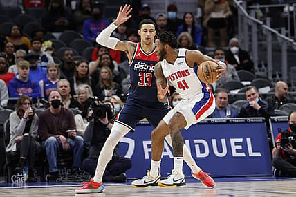 Dec 8, 2021; Detroit, Michigan, USA;  Detroit Pistons forward Saddiq Bey (41) dribbles defended by Washington Wizards forward Kyle Kuzma (33) in the first half at Little Caesars Arena. Mandatory Credit: Rick Osentoski-USA TODAY Sports