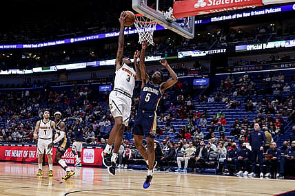 Dec 8, 2021; New Orleans, Louisiana, USA;  Denver Nuggets guard Bones Hyland (3) shoots against New Orleans Pelicans forward Herbert Jones (5) during the first half at Smoothie King Center. Mandatory Credit: Stephen Lew-USA TODAY Sports