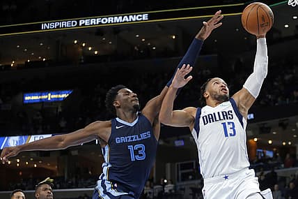 Dec 8, 2021; Memphis, Tennessee, USA; Dallas Mavericks guard Jalen Brunson (13) drives to the basket as Memphis Grizzles forward Jaren Jackson Jr. (13) defends during the first half at FedExForum. Mandatory Credit: Petre Thomas-USA TODAY Sports