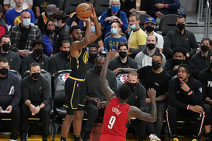 December 8, 2021; San Francisco, California, USA; Golden State Warriors forward Andrew Wiggins (22) shoots the basketball against Portland Trail Blazers forward Nassir Little (9) during the third quarter at Chase Center. Mandatory Credit: Kyle Terada-USA TODAY Sports