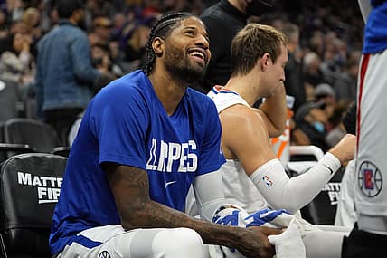 Dec 4, 2021; Sacramento, California, USA; LA Clippers guard Paul George (13) sits on the bench during the second quarter against the Sacramento Kings at Golden 1 Center. Mandatory Credit: Darren Yamashita-USA TODAY Sports