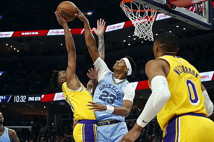 Dec 9, 2021; Memphis, Tennessee, USA; Memphis Grizzles guard Jarrett Culver (23) blocks the shot of Los Angeles Lakers guard Malik Monk (11) during the first half at FedExForum. Mandatory Credit: Petre Thomas-USA TODAY Sports