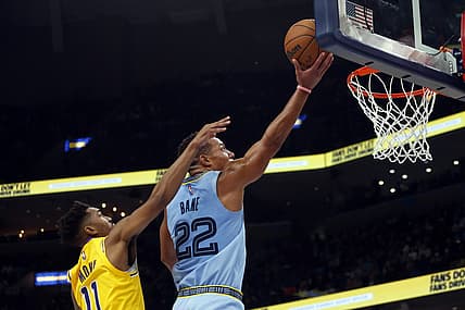 Dec 9, 2021; Memphis, Tennessee, USA; Memphis Grizzles guard Desmond Bane (22) drives to the basket as Los Angeles Lakers guard Malik Monk (11) defends during the second half at FedExForum. Mandatory Credit: Petre Thomas-USA TODAY Sports
