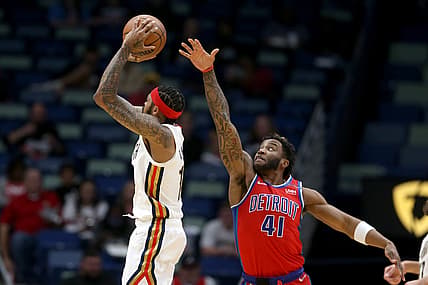 Dec 10, 2021; New Orleans, Louisiana, USA; New Orleans Pelicans forward Brandon Ingram (14) shoots while defended by Detroit Pistons forward Saddiq Bey (41) in the first quarter at the Smoothie King Center. Mandatory Credit: Chuck Cook-USA TODAY Sports