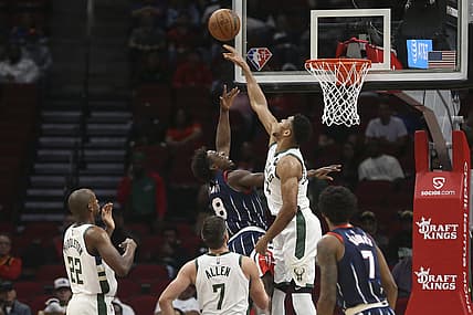 Dec 10, 2021; Houston, Texas, USA;  Milwaukee Bucks forward Giannis Antetokounmpo (34) blocks Houston Rockets forward Jae'Sean Tate (8) shot in the first quarter at Toyota Center. Mandatory Credit: Thomas Shea-USA TODAY Sports