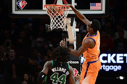 Dec 10, 2021; Phoenix, Arizona, USA; Phoenix Suns forward Jalen Smith (10) dunks over Boston Celtics center Robert Williams III (44) during the first half at Footprint Center. Mandatory Credit: Joe Camporeale-USA TODAY Sports