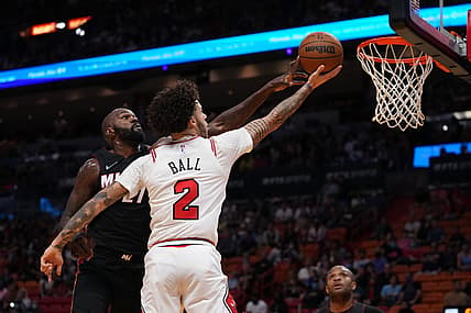 Dec 11, 2021; Miami, Florida, USA; Miami Heat center Dewayne Dedmon (21) blocks the shot of Chicago Bulls guard Lonzo Ball (2) during the first half at FTX Arena. Mandatory Credit: Jasen Vinlove-USA TODAY Sports