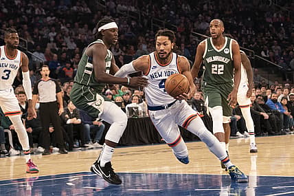 Dec 12, 2021; New York, New York, USA; New York Knicks point guard Derrick Rose (4) dribbles the ball against Milwaukee Bucks center Bobby Portis (9) during the first half at Madison Square Garden. Mandatory Credit: Gregory Fisher-USA TODAY Sports