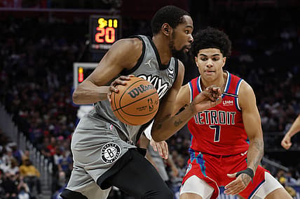 Dec 12, 2021; Detroit, Michigan, USA; Brooklyn Nets forward Kevin Durant (7) dribbles defended by Detroit Pistons guard Killian Hayes (7) in the first half at Little Caesars Arena. Mandatory Credit: Rick Osentoski-USA TODAY Sports