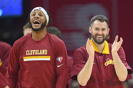 Dec 13, 2021; Cleveland, Ohio, USA; Cleveland Cavaliers forward Lamar Stevens (8), left, and forward Kevin Love (0) celebrate in the second quarter against the Miami Heat at Rocket Mortgage FieldHouse. Mandatory Credit: David Richard-USA TODAY Sports