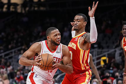 Dec 13, 2021; Atlanta, Georgia, USA; Houston Rockets guard Eric Gordon (10) is defended by Atlanta Hawks forward John Collins (20) during the first half at State Farm Arena. Mandatory Credit: Dale Zanine-USA TODAY Sports