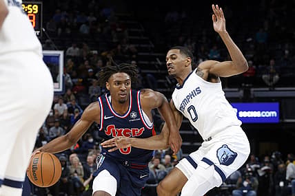 Dec 13, 2021; Memphis, Tennessee, USA; Philadelphia 76ers guard Tyrese Maxey (0) drives to the basket as Memphis Grizzles guard De'Anthony Melton (0) defends during the first half at FedExForum. Mandatory Credit: Petre Thomas-USA TODAY Sports