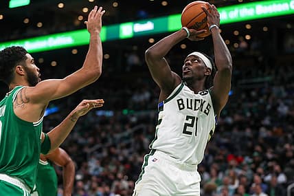 Dec 13, 2021; Boston, Massachusetts, USA; Milwaukee Bucks guard Jrue Holiday (21) shoots during the second half against the Boston Celtics at TD Garden. Mandatory Credit: Paul Rutherford-USA TODAY Sports