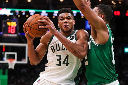 Dec 13, 2021; Boston, Massachusetts, USA; Milwaukee Bucks forward Giannis Antetokounmpo (34) drives to the basket defended by Boston Celtics forward Grant Williams (12) during the second half at TD Garden. Mandatory Credit: Paul Rutherford-USA TODAY Sports