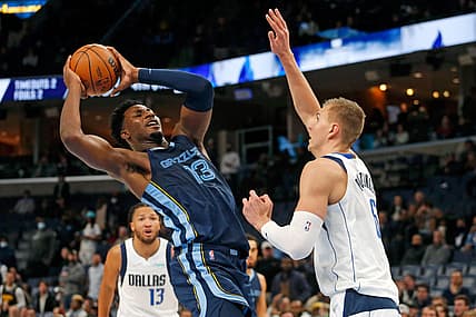 Dec 8, 2021; Memphis, Tennessee, USA; Memphis Grizzles forward Jaren Jackson Jr. (13) shoots as Dallas Mavericks center Kristaps Porzingis (6) defends during the second half at FedExForum. Mandatory Credit: Petre Thomas-USA TODAY Sports