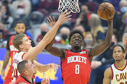 Dec 15, 2021; Cleveland, Ohio, USA; Houston Rockets forward Jae'Sean Tate (8) rebounds beside Cleveland Cavaliers forward Lauri Markkanen (24) in the first quarter at Rocket Mortgage FieldHouse. Mandatory Credit: David Richard-USA TODAY Sports