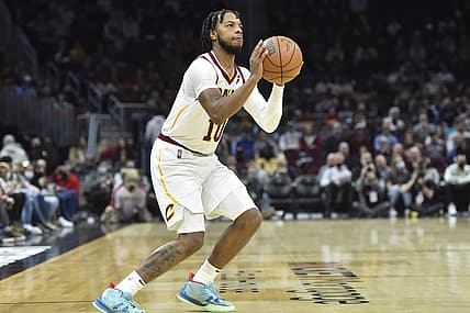 Dec 15, 2021; Cleveland, Ohio, USA; Cleveland Cavaliers guard Darius Garland (10) shoots a three-point basket in the third quarter against the Houston Rockets at Rocket Mortgage FieldHouse. Mandatory Credit: David Richard-USA TODAY Sports