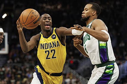 Dec 15, 2021; Milwaukee, Wisconsin, USA;  Indiana Pacers guard Caris LeVert (22) drives for the basket against Milwaukee Bucks guard Rodney Hood (5) during the third quarter at Fiserv Forum. Mandatory Credit: Jeff Hanisch-USA TODAY Sports