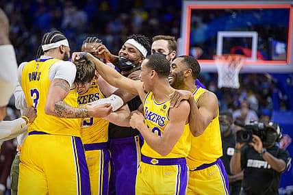 Dec 15, 2021; Dallas, Texas, USA; The Los Angeles Lakers celebrate guard Austin Reaves (15) making a three point shot to defeat the Dallas Mavericks during overtime at the American Airlines Center. Mandatory Credit: Jerome Miron-USA TODAY Sports