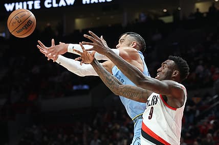 Dec 15, 2021; Portland, Oregon, USA;  Memphis Grizzlies forward Dillon Brooks (24) and Portland Trail Blazers forward Nassir Little (9) fight for the ball in the first half at Moda Center. Mandatory Credit: Jaime Valdez-USA TODAY Sports