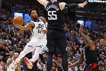 Dec 15, 2021; Salt Lake City, Utah, USA; Utah Jazz guard Donovan Mitchell (45) gets off a pass against LA Clippers center Isaiah Hartenstein (55) in the second quarter at Vivint Arena. Mandatory Credit: Jeffrey Swinger-USA TODAY Sports