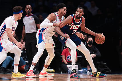 Dec 16, 2021; Brooklyn, New York, USA; Brooklyn Nets forward Kevin Durant (7) dribbles as Philadelphia 76ers forward Tobias Harris (12) defends during the first half at Barclays Center. Mandatory Credit: Vincent Carchietta-USA TODAY Sports
