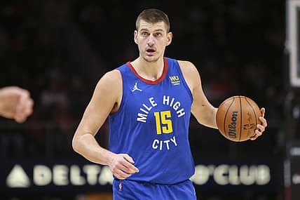 Dec 17, 2021; Atlanta, Georgia, USA; Denver Nuggets center Nikola Jokic (15) handles the ball against the Atlanta Hawks in the first quarter at State Farm Arena. Mandatory Credit: Brett Davis-USA TODAY Sports