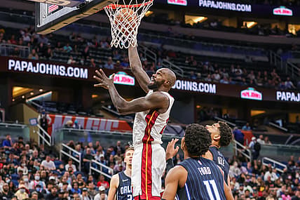 Dec 17, 2021; Orlando, Florida, USA; Miami Heat center Dewayne Dedmon (21) dunks the ball during the second quarter against the Orlando Magic at Amway Center. Mandatory Credit: Mike Watters-USA TODAY Sports