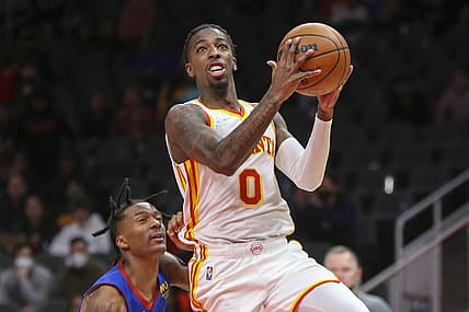 Dec 17, 2021; Atlanta, Georgia, USA; Atlanta Hawks guard Delon Wright (0) shoots against the Denver Nuggets in the second half at State Farm Arena. Mandatory Credit: Brett Davis-USA TODAY Sports