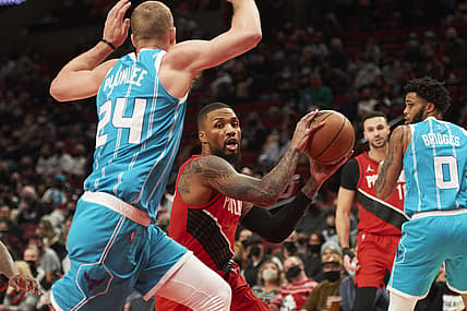 Dec 17, 2021; Portland, Oregon, USA; Portland Trail Blazers guard Damian Lillard (0) drives to the basket against Charlotte Hornets center Mason Plumlee (24) during the first half at Moda Center. Mandatory Credit: Troy Wayrynen-USA TODAY Sports