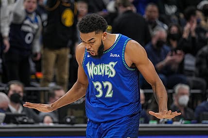 Dec 17, 2021; Minneapolis, Minnesota, USA; Minnesota Timberwolves center Karl-Anthony Towns (32) celebrates his basket against the Los Angeles Lakers in the second quarter at Target Center. Mandatory Credit: Brad Rempel-USA TODAY Sports