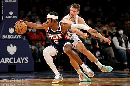 Dec 18, 2021; Brooklyn, New York, USA; Brooklyn Nets guard David Duke Jr. (6) steals the ball from Orlando Magic forward Franz Wagner (22) during the fourth quarter at Barclays Center. Mandatory Credit: Brad Penner-USA TODAY Sports