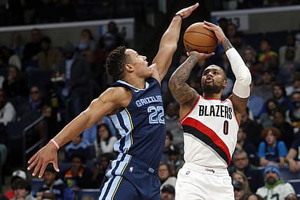 Dec 19, 2021; Memphis, Tennessee, USA; Portland Trail Blazers guard Damian Lillard (0) shoots for three over Memphis Grizzles guard Desmond Bane (22) during the first half at FedExForum. Mandatory Credit: Petre Thomas-USA TODAY Sports