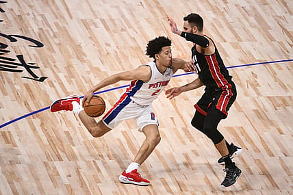Dec 19, 2021; Detroit, Michigan, USA; Detroit Pistons guard Cade Cunningham (2) drives to the basket as Miami Heat guard Max Strus (31) defends during the third quarter at Little Caesars Arena. Mandatory Credit: Tim Fuller-USA TODAY Sports