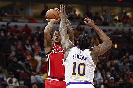 Dec 19, 2021; Chicago, Illinois, USA; Chicago Bulls forward DeMar DeRozan (11) shoots against Los Angeles Lakers center DeAndre Jordan (10) during the first half at United Center. Mandatory Credit: Kamil Krzaczynski-USA TODAY Sports