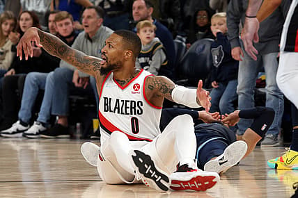 Dec 19, 2021; Memphis, Tennessee, USA; Portland Trail Blazers guard Damian Lillard (0) reacts after a foul call on Memphis Grizzles guard Dillon Brooks (24) late in the fourth quarter at FedExForum. Mandatory Credit: Petre Thomas-USA TODAY Sports