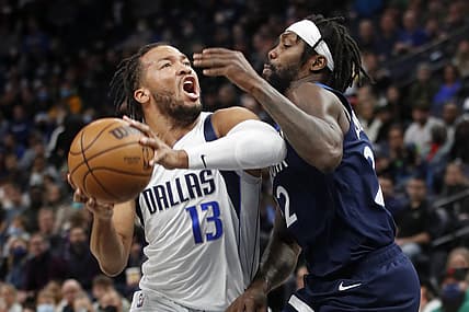 Dec 19, 2021; Minneapolis, Minnesota, USA; Dallas Mavericks guard Jalen Brunson (13) works around Minnesota Timberwolves guard Patrick Beverley (22) in the first quarter at Target Center. Mandatory Credit: Bruce Kluckhohn-USA TODAY Sports